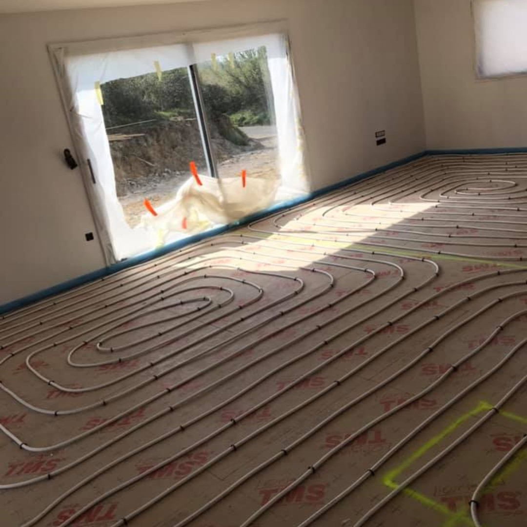 Installation d'un plancher chauffant dans un salon séjour de 40m2 à Saint-Omer.
